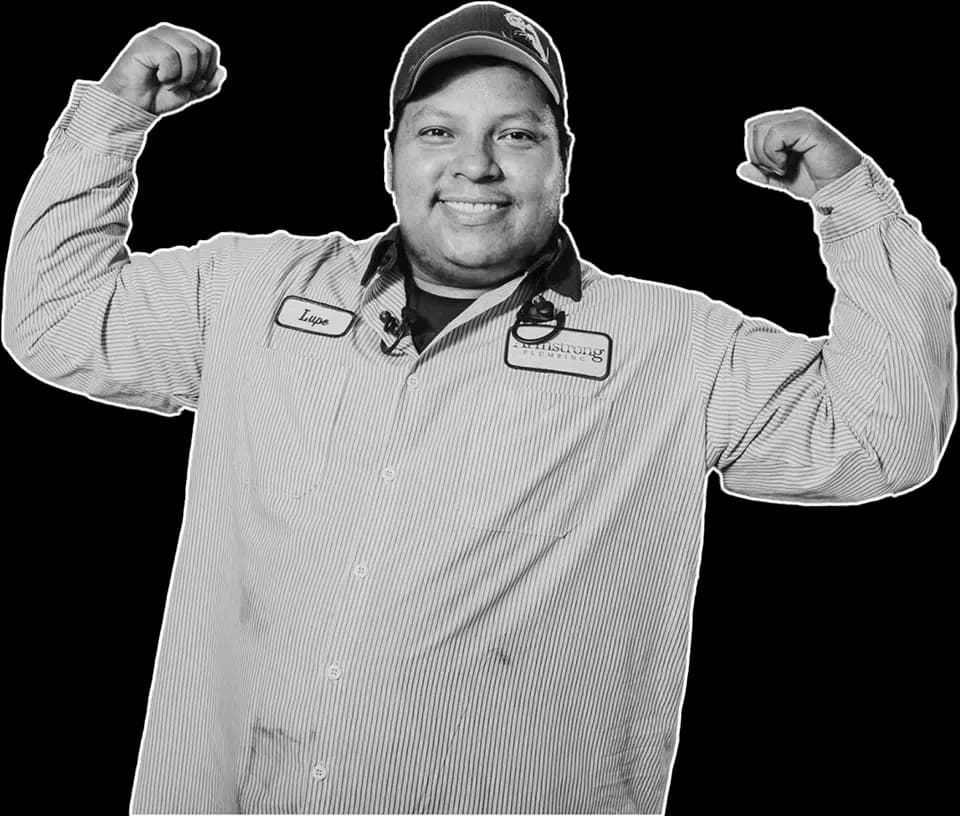 Armstong Plumbing employee flexing