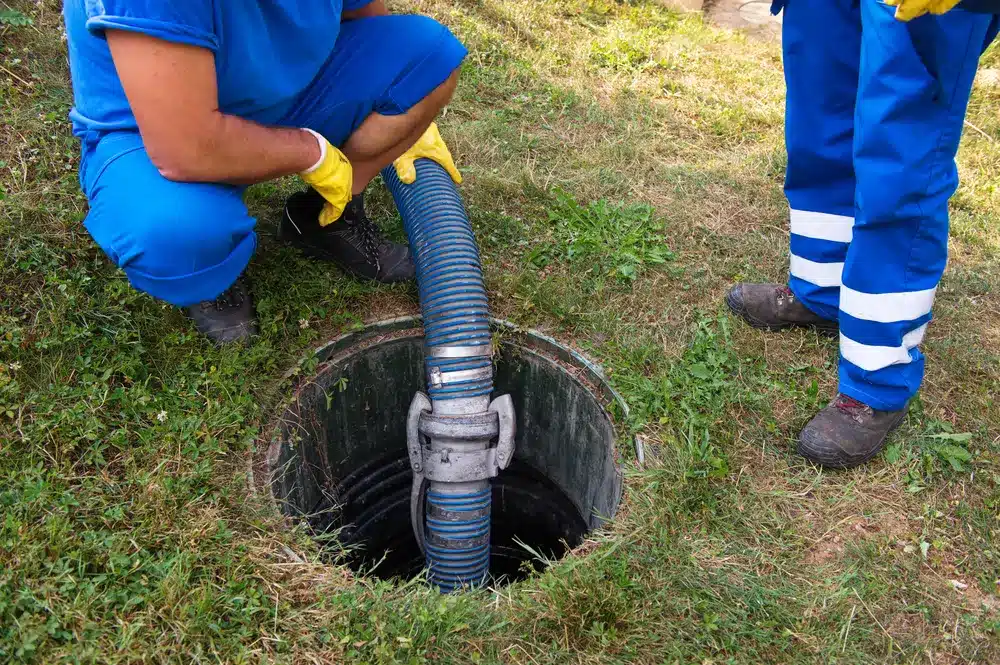 Technicians cleaning sewer in Sacramento, CA.