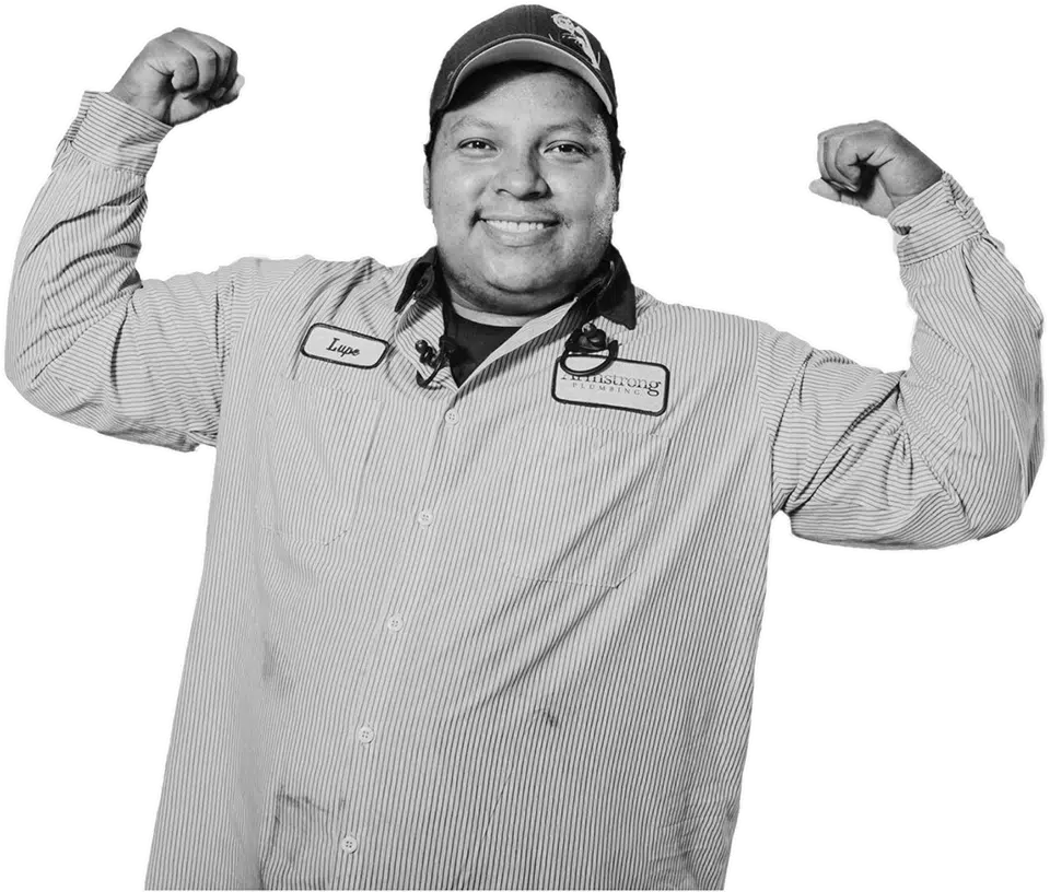 Armstong Plumbing employee flexing